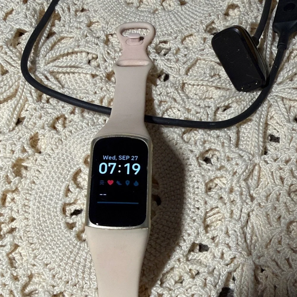 Elegant Fitbit Smartwatch (charge 5) with pink Band